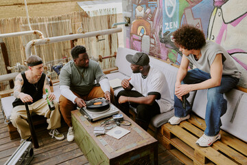 High angle shot of multiracial friends partying together in backyard