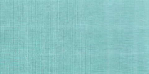 Fototapeta premium Textured solid fabric background in light teal color with copy space