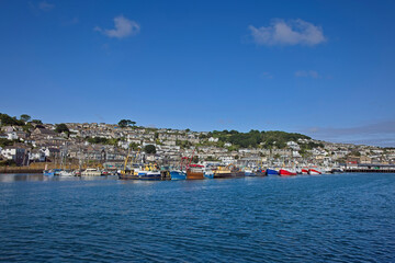 Newlyn, with the harbour and trawlers in the foreground, Cornwall, UK.