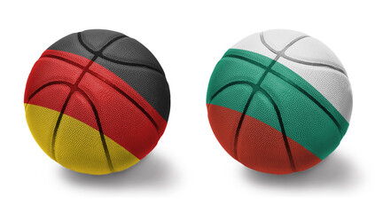 basketball balls with the national flags of bulgaria and germany on the white background.