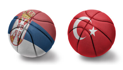 basketball balls with the national flags of turkey and serbia on the white background.