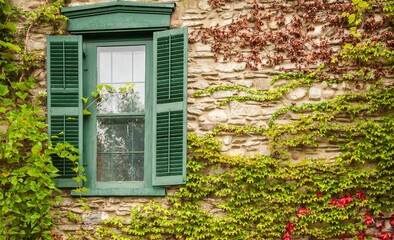 Shuttered window in the stone wall of a winery in Finger Lakes region of upper New york