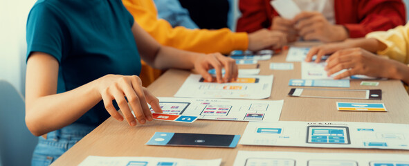 Panorama banner of startup company employee planning on user interface prototype for mobile application or website in office. UX UI designer brainstorm user friendly interface plan. Synergic