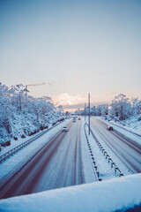Two Lanes of a Autobahn Highway Covered with Ice and Snow on a Beautiful Morning