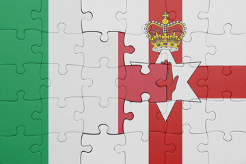 puzzle with the colourful national flag of northern ireland and flag of italy .