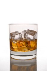 single malt whiskey with ice in a glass isolated on white background