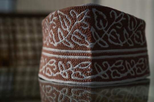 A traditional Omani cap in beautiful colors called kumma , which is part of the Omani traditional costume