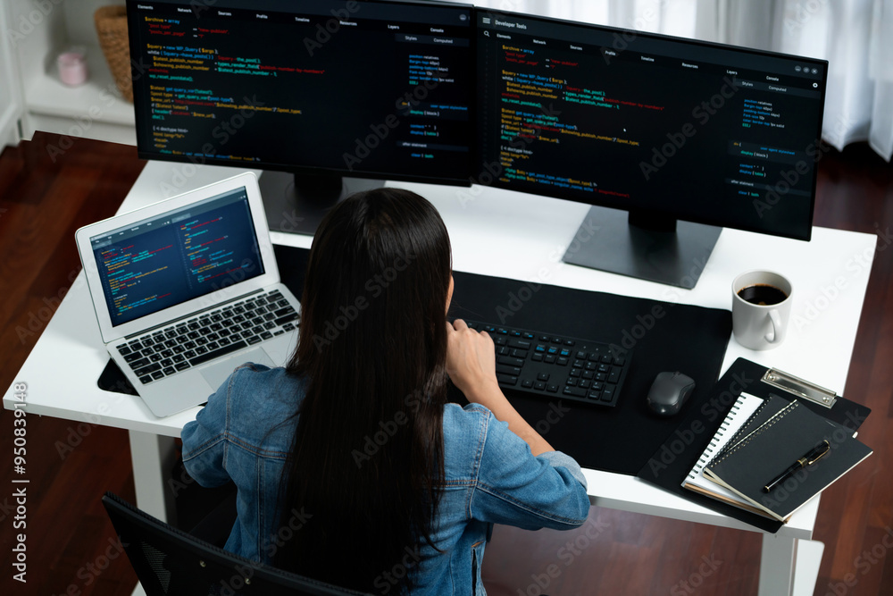 Poster top view young asian it developer creating with typing online information on pc with coding program 