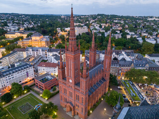 Aerial Drone Shot of Cathedral at Marktkirche in Wiesbaden, Germany. Old town and the city center at Evening Twilight.