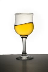 A glass of apple juice with red apples isolated on white background