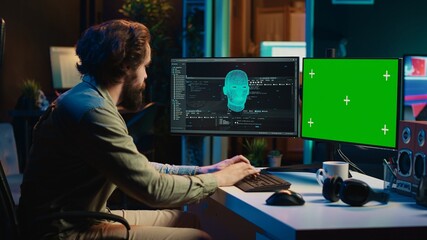 Man being asked existential questions by awaken AI on green screen PC, gaining consciousness. IT professional speaking with artificial intelligence on chroma key PC, camera A