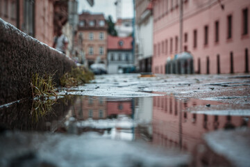 Close up of a puddle of water on city street