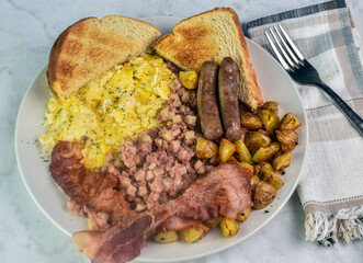scramble eggs   with home fries, bacon sausage and toast