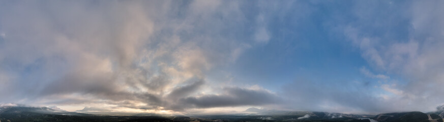 Breathtaking Sunrise Over the Alberta Mountains in Canada with a Serene Sky