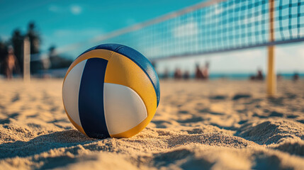 Volleyball lying on the sand of beach with a net in the background. blurred people player behind.