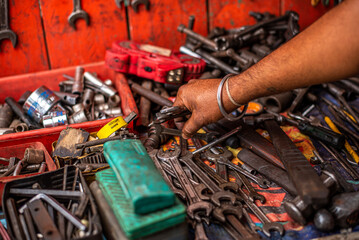 Bunch of messy hand tools in an auto mechanic garage