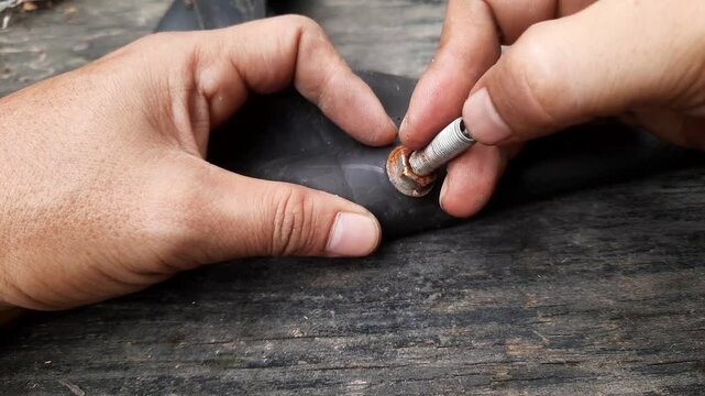 The inner tire valve of the motorbike is damaged and rusty. Motorcycle tire air hole distributor