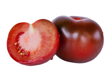 Black tomato. Cut and whole tomato black and red isolate. Vegetable isolate.