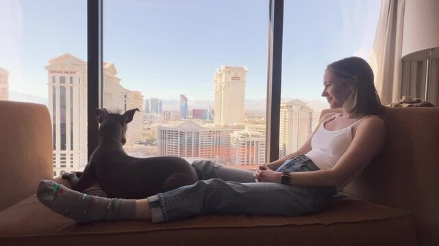 LAS VEGAS Women and Xolo looking out to city morning
