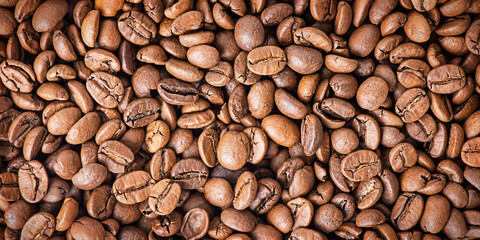 Roasted coffee beans as a background. Coffee has many beans