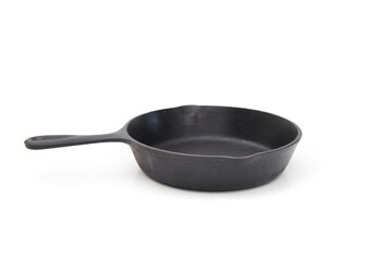 Vintage cast iron pan with drip top. Round frying pan made of cast iron. Seasoned pan used to cook evenly on stove top and oven save. Vintage black cookware. White background. Selective focus.