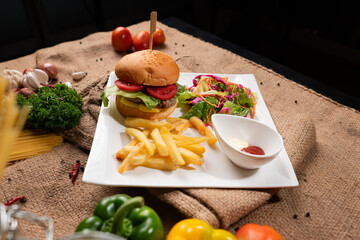 Crispy fries, juicy burger, and a fresh salad – what more could you ask for?