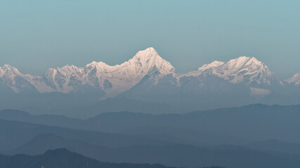 Beautiful scenery of Gongga snow mountain viewed at the top of Emei in early morning. Gongga...