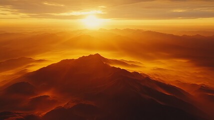 Naklejka premium Golden Hour Majesty: Aerial Sunrise Over Majestic Mountain Range 1