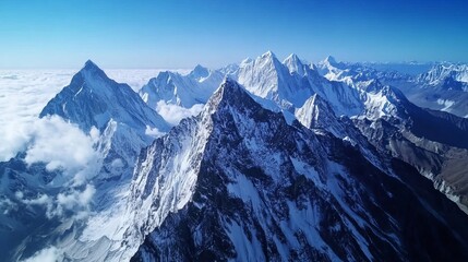 Fototapeta premium Majestic Snow-Capped Peaks: Aerial View of a Breathtaking Mountain Range
