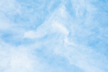 Milky sky with clouds resembling mist. Soft heaven texture of the sky. Hazy, foglike clouds...