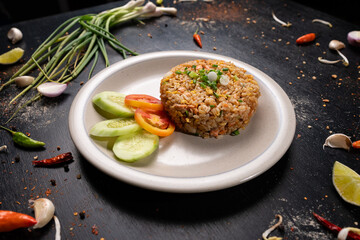 Enjoy the taste of home with this classic fried rice dish, complete with fresh veggie sides.