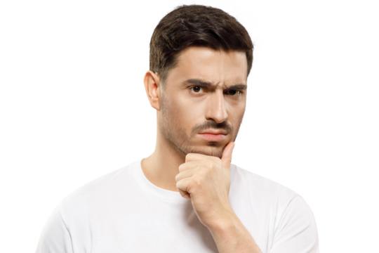 Close-up of young man in white t-shirt, holding his chin, looking at camera with expression of suspicion, mistrusting and doubting