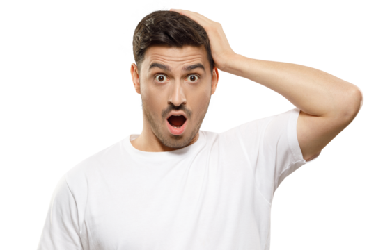 Young handsome man in white t-shirt touching head with hand, looking with amazed shocked eyes and open mouth