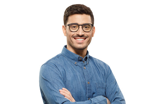 Young handsome businessman wearing blue shirt and glasses, holding arms crossed, smiling and feeling confident