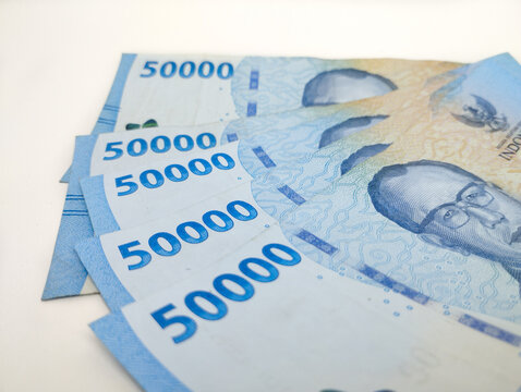 Close up Fifty thousand Indonesian banknotes (Rupiah). Cash payment concept. Indonesian rupiah currency (Rp. 50,000 Fifty Thousand Rupiah) on a white background