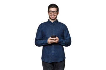 Handsome smiling young businessman holding his phone, wearing casual blue denim shirt and trendy glasses