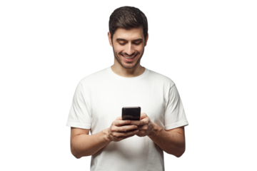Young man standing, looking at screen of phone with smile, browsing web pages or chatting with friend
