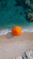 Naklejka premium Tranquil Overhead View of Vibrant Beach Umbrella on Serene Coastal Landscape