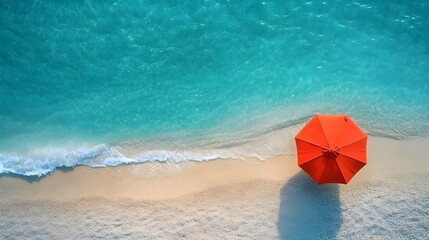 Fototapeta premium Aerial View of Vibrant Red Umbrella on Serene Tropical Beach with Turquoise Waters