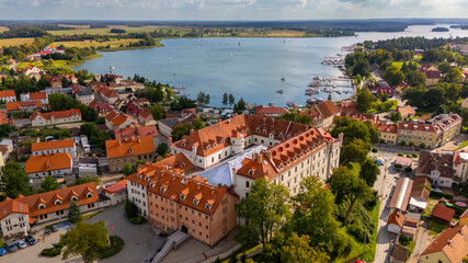 Aerial view of Ryn Castle in Poland with town of Ryn and lake