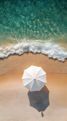Naklejka premium Aerial View of Idyllic Beach with Elegant White Umbrella and Ample Blank Space for Magazine Style Editorial Design