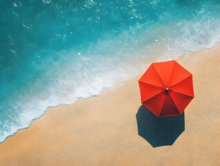 Naklejka premium Aerial View of Lone Beach Umbrella in Tranquil Coastal Scenery