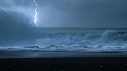 Powerful lightning strikes over turbulent ocean waves at night during a storm