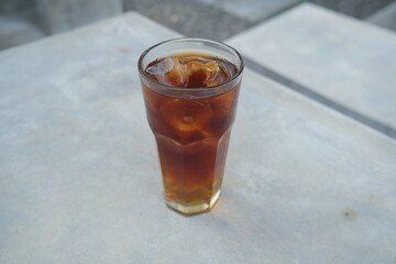Close-up of a glass of iced tea on a table.