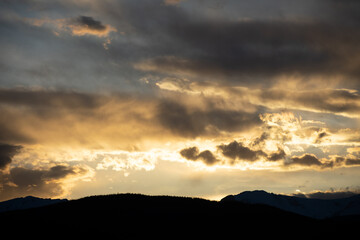 Sun setting Behind the Colorado Rocky Mountains