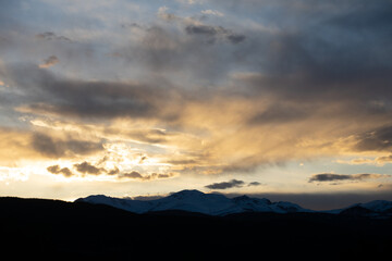 Sun setting Behind the Colorado Rocky Mountains