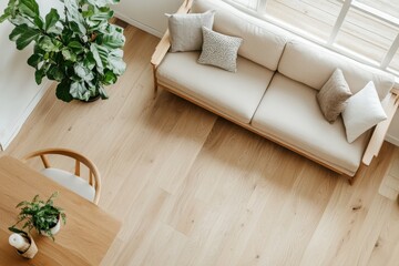 Cozy Scandinavian Living Room with Beige Sofa and Earthy Accents, Bathed in Soft Natural Light from Top-Down View