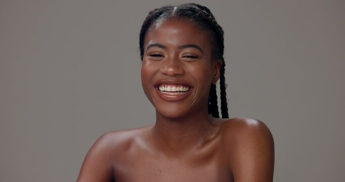Black woman, portrait and laugh in studio for skincare, confidence or natural beauty. happy, clear skin or person on gray background with cosmetics, luxury glow or dermatology for wellness in Nigeria