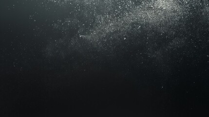 Obraz premium Sand particles explosion on a black background, dynamic and dramatic effect with a focus on texture and movement.