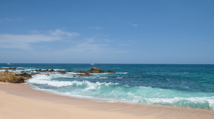 THE WIDOWS BEACH, cabo san lucas Baja California Sur MEXICO.  Panoramic seascape of los cabos with rocks in the sea and waves